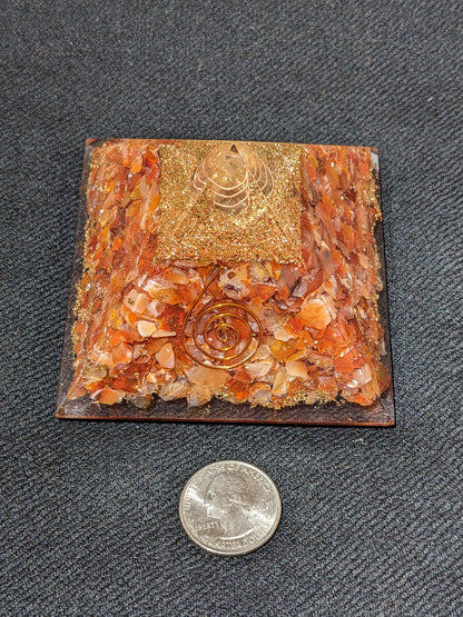 Orgonite Pyramid with Carnelian and spiral symbol